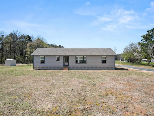 view of front facade with entry steps and a front yard