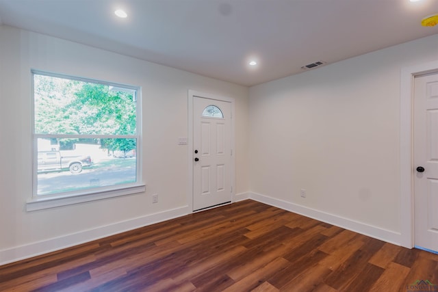 entrance foyer with dark wood-style floors, visible vents, recessed lighting, and baseboards