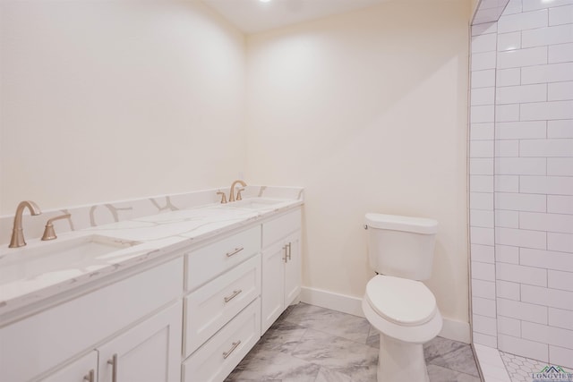 109 Montie St, Longview, TX 75604 - full bath with marble finish floor, toilet, baseboards, and a sink