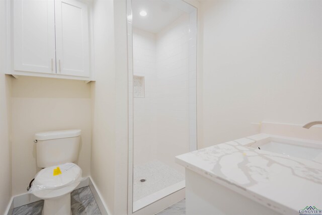 109 Montie St, Longview, TX 75604 - bathroom featuring a sink, baseboards, toilet, and a tile shower