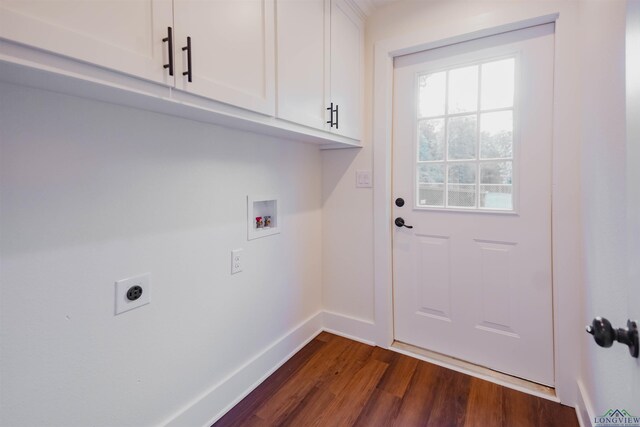 109 Montie St, Longview, TX 75604 - laundry area with hookup for a washing machine, baseboards, hookup for an electric dryer, dark wood finished floors, and cabinet space