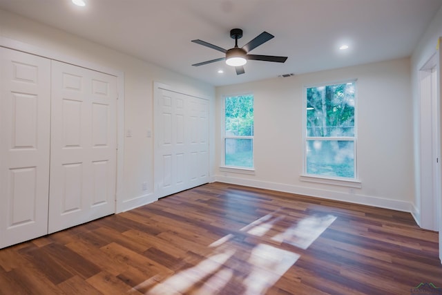 109 Montie St, Longview, TX 75604 - unfurnished bedroom featuring recessed lighting, visible vents, multiple closets, and wood finished floors