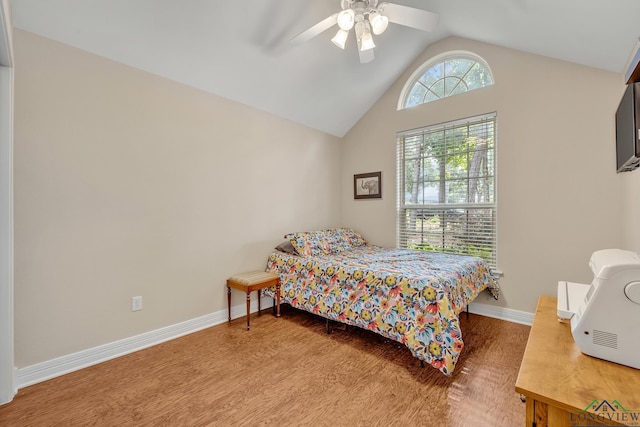 801 NW Dr, Longview, TX 75604 - bedroom with wood finished floors, lofted ceiling, and a ceiling fan