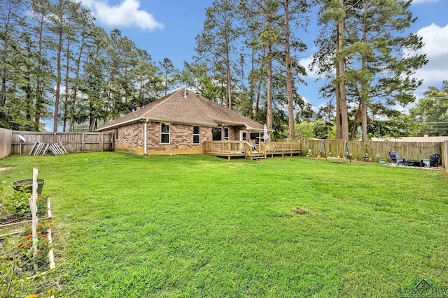 801 NW Dr, Longview, TX 75604 - fenced backyard with a wooden deck