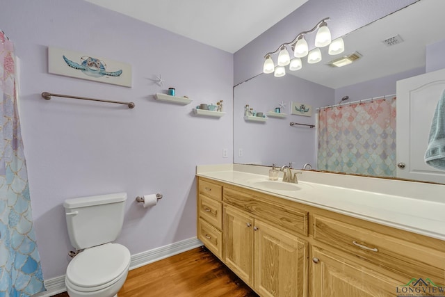801 NW Dr, Longview, TX 75604 - full bathroom with vanity, wood finished floors, and curtained shower