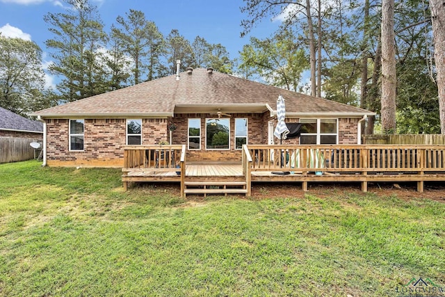 801 NW Dr, Longview, TX 75604 - rear view of house featuring a fenced backyard, brick siding, and roof with shingles