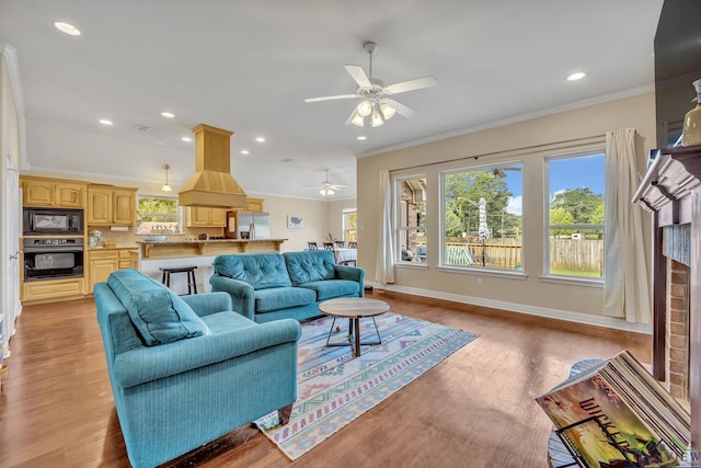 801 NW Dr, Longview, TX 75604 - living area featuring ornamental molding, plenty of natural light, a ceiling fan, recessed lighting, and light wood finished floors