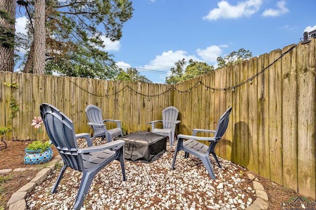801 NW Dr, Longview, TX 75604 - view of patio featuring a fire pit