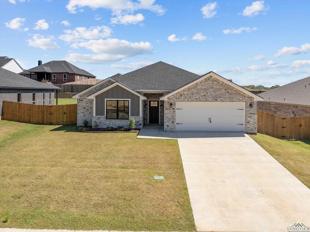 view of front of property with a garage and a front yard