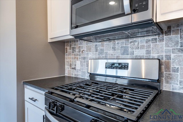 kitchen featuring tasteful backsplash, white cabinets, and stainless steel appliances