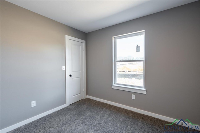 empty room with carpet flooring