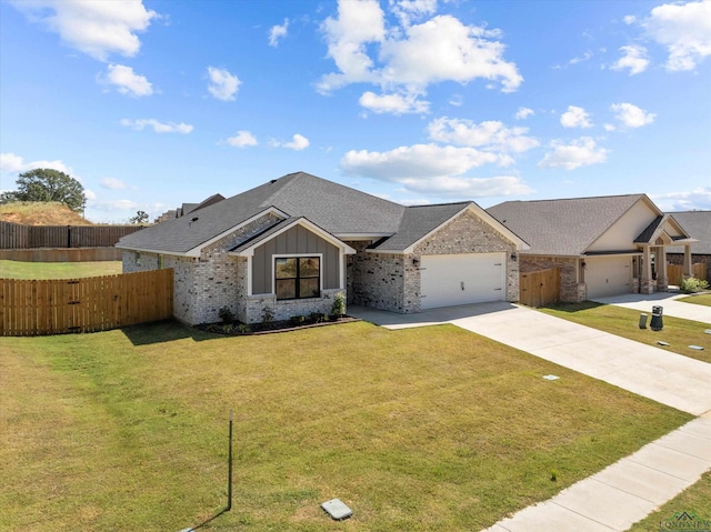 ranch-style home with a front yard and a garage