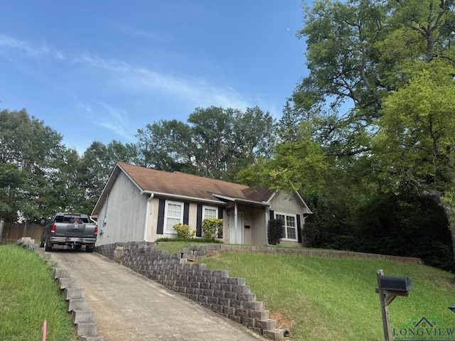 42 Wingwood Ter, Marshall, TX 75670 - ranch-style house featuring concrete driveway and a front lawn