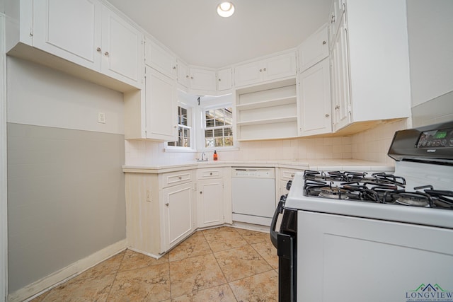 kitchen featuring white cabinetry and white appliances