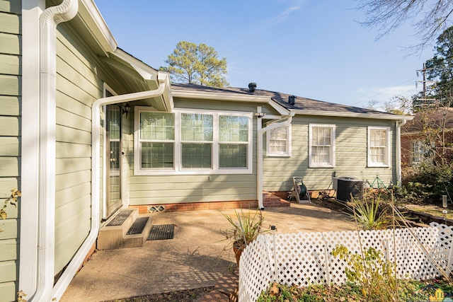 back of property featuring central AC and a patio