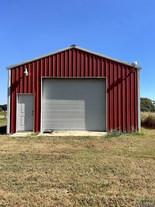 garage featuring a yard