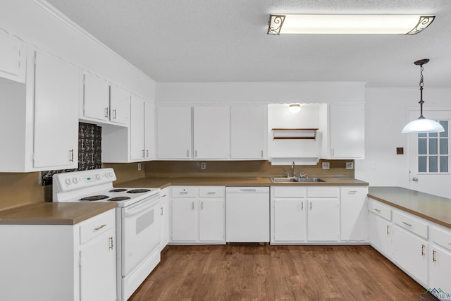 kitchen featuring pendant lighting, white appliances, sink, a textured ceiling, and white cabinetry