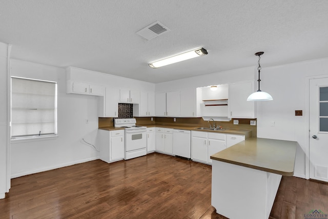 kitchen featuring white cabinets, kitchen peninsula, white appliances, and hanging light fixtures