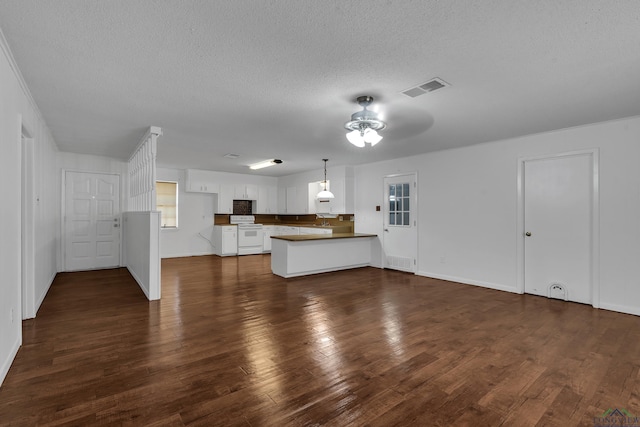 unfurnished living room featuring a textured ceiling, dark hardwood / wood-style flooring, and ceiling fan