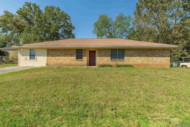 single story home with a front yard