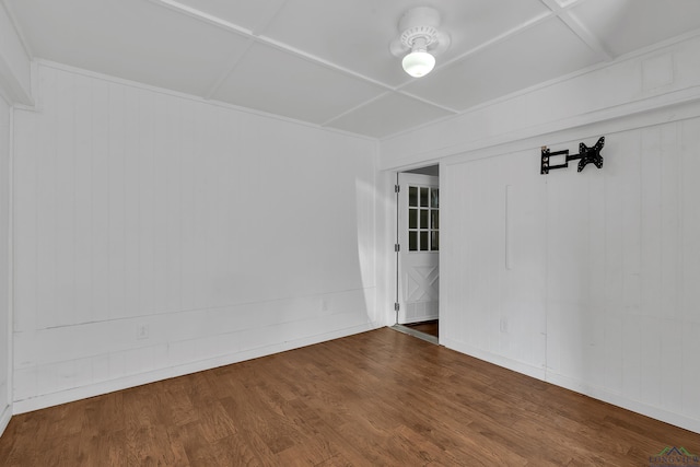 unfurnished room with wood-type flooring