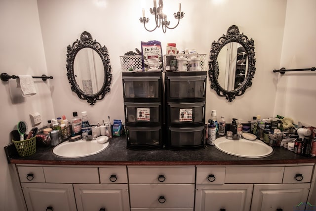 bathroom with vanity and a notable chandelier