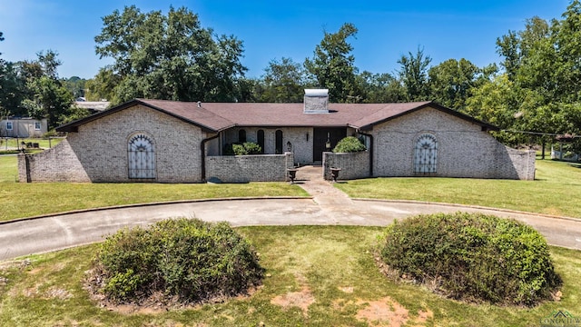 ranch-style home with a front yard