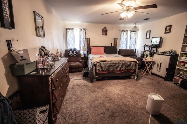 bedroom featuring ceiling fan, light carpet, and multiple windows