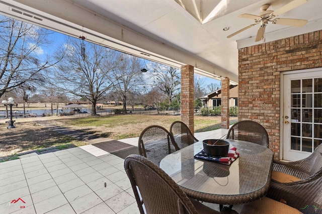 view of patio / terrace featuring a ceiling fan and outdoor dining area