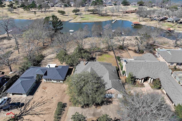 drone / aerial view with a water view and a residential view