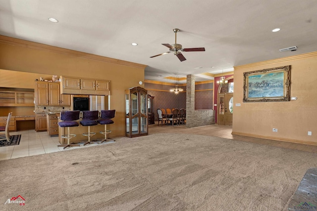 unfurnished living room with ornamental molding, light colored carpet, visible vents, and recessed lighting