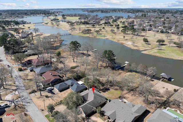 birds eye view of property featuring a water view and a residential view