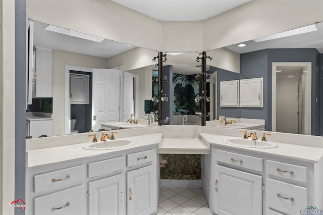 full bathroom with tile patterned flooring, vanity, and toilet