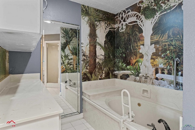 bathroom with tile patterned flooring, a garden tub, and a textured ceiling