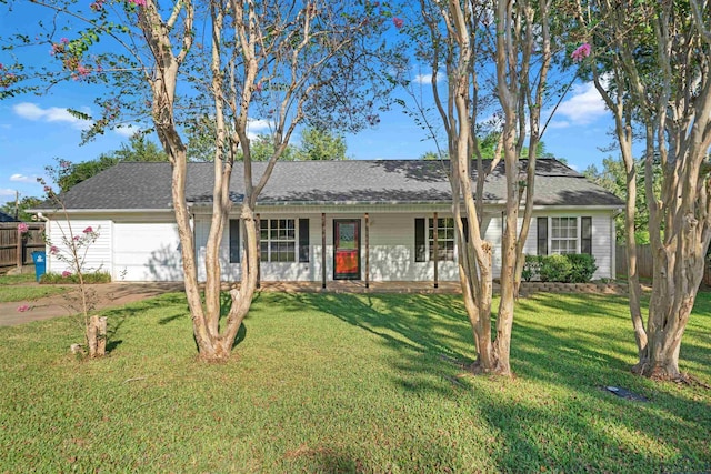 single story home featuring a garage and a front yard