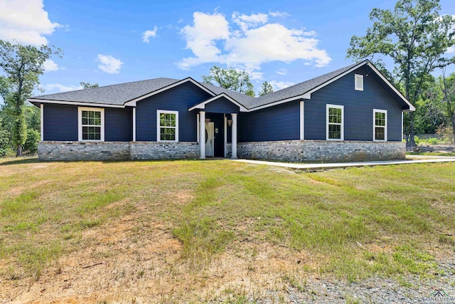 ranch-style house with brick siding and a front yard