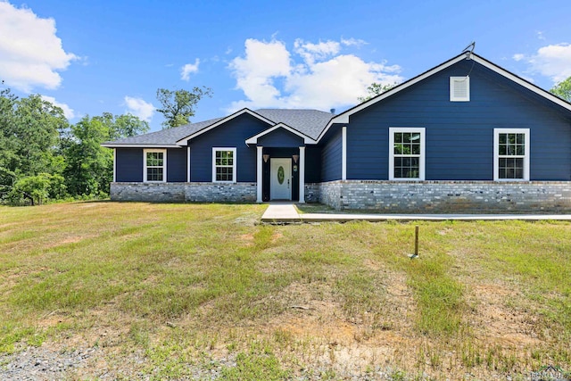 ranch-style home with a front lawn and brick siding