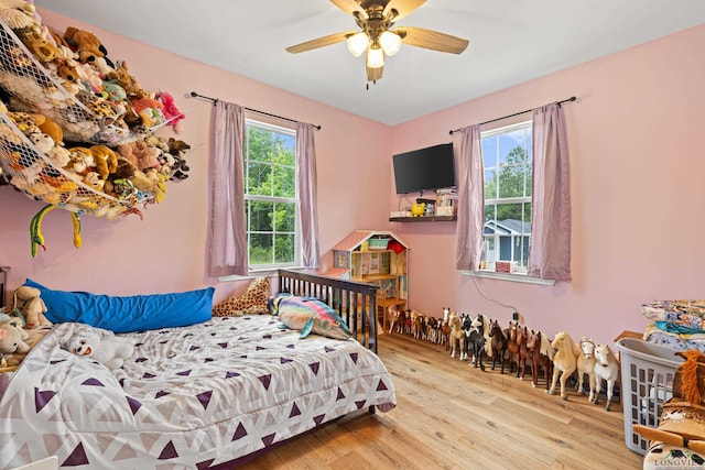 bedroom featuring a ceiling fan and light wood finished floors