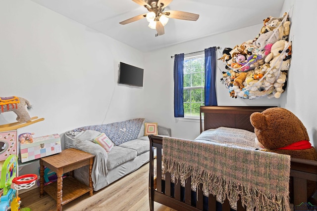 bedroom featuring ceiling fan and light wood-style flooring