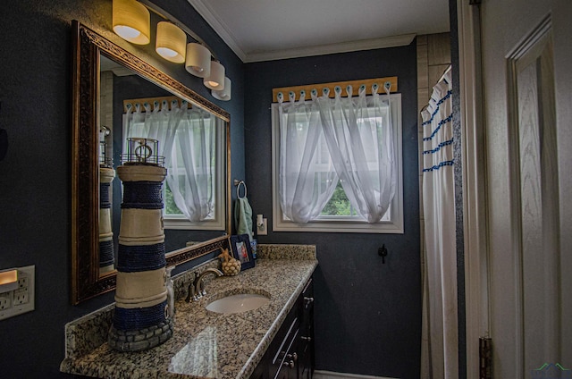 bathroom with vanity and ornamental molding