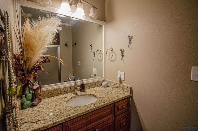 bathroom with vanity and crown molding