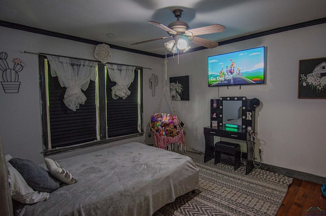 bedroom featuring hardwood / wood-style flooring, ceiling fan, and crown molding