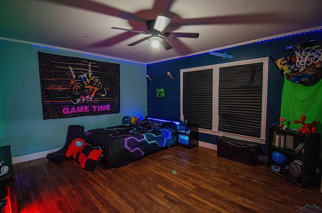 bedroom featuring hardwood / wood-style flooring and ceiling fan