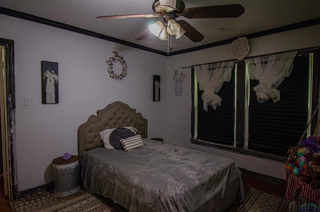 bedroom with ceiling fan and crown molding