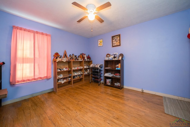 misc room featuring hardwood / wood-style floors and ceiling fan