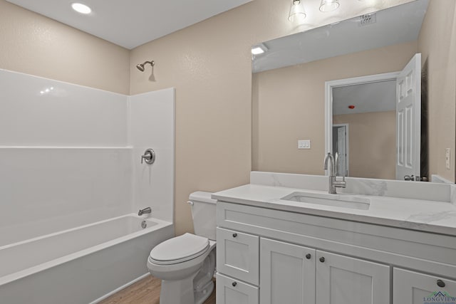 full bathroom featuring visible vents, toilet, bathtub / shower combination, wood finished floors, and vanity