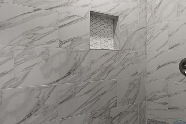 details featuring a tile shower