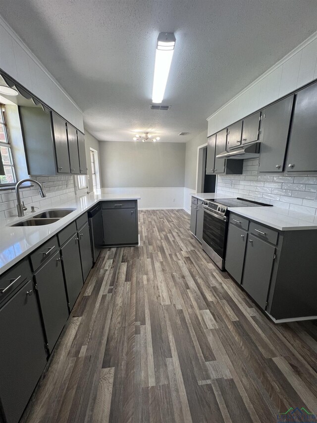 clothes washing area with hookup for a washing machine, dark hardwood / wood-style flooring, cabinets, and hookup for an electric dryer