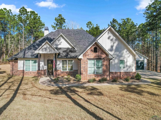 craftsman inspired home featuring a garage and a front yard