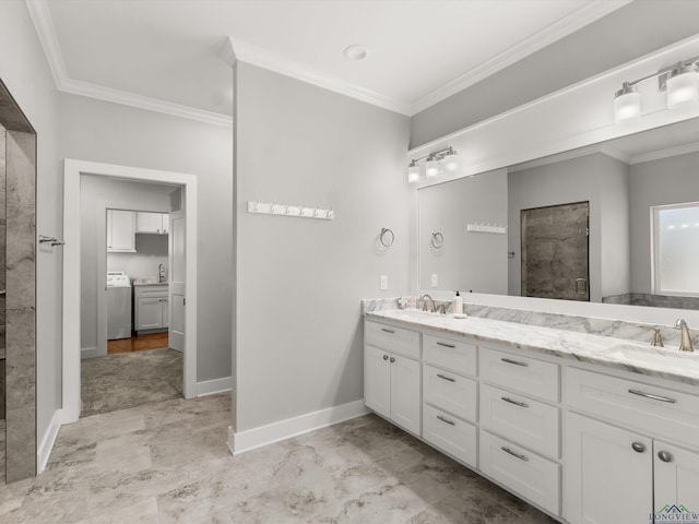 bathroom with walk in shower, crown molding, washer / dryer, and vanity